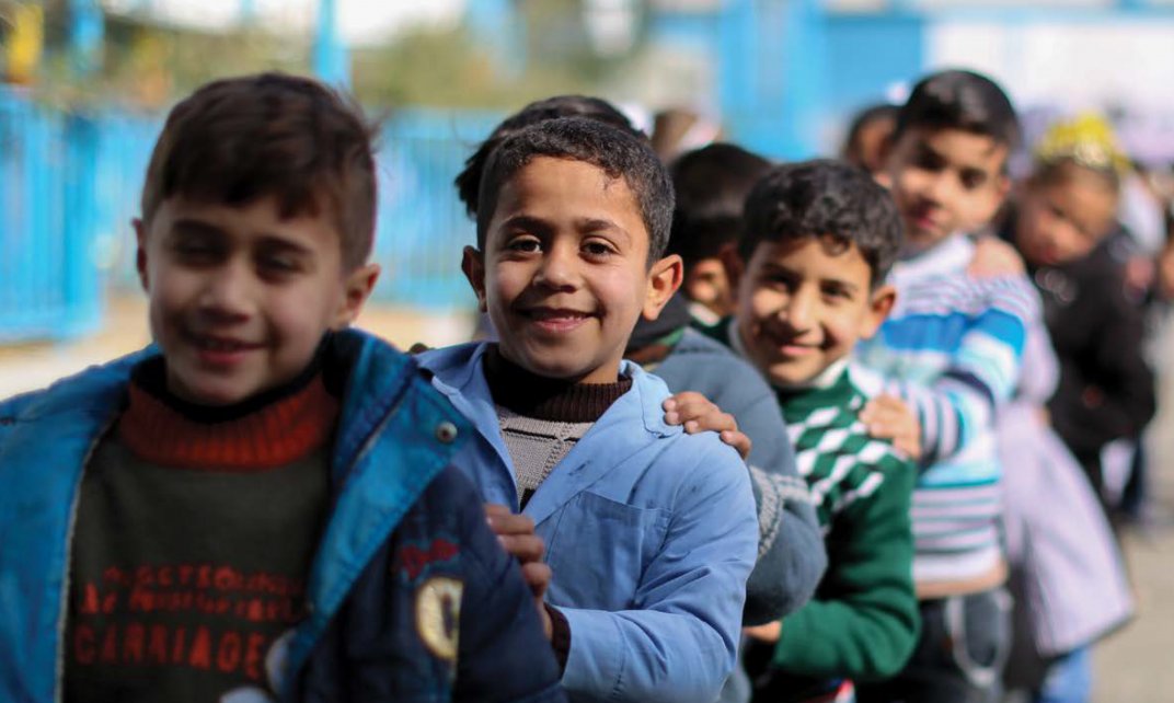 Palestijnse vluchtelingenkinderen op hun eerste schooldag op een UNRWA-school in Gaza. (Foto: UNRWA | Rushdi Sarraj)